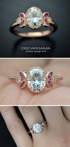 Oval engagement ring with marquise rubies in rose gold vintage inspired in a hand