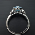 Oval blue aqua marine engagement ring with marquise sapphires front fiew