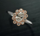 oval natural diamond flower halo two tone ring