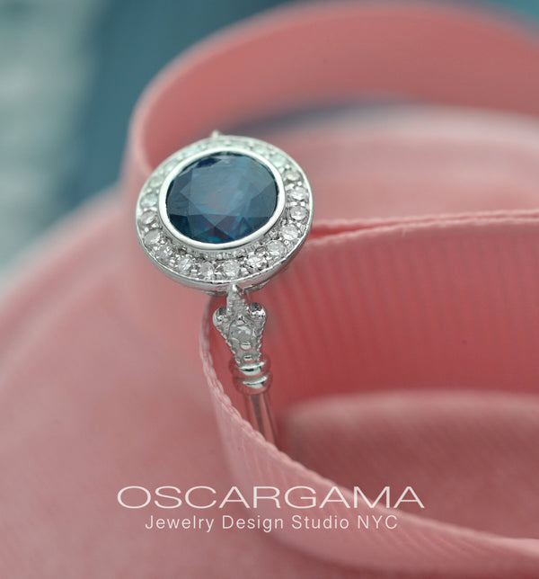 blue sapphire vintage engagement ring in white gold pink background